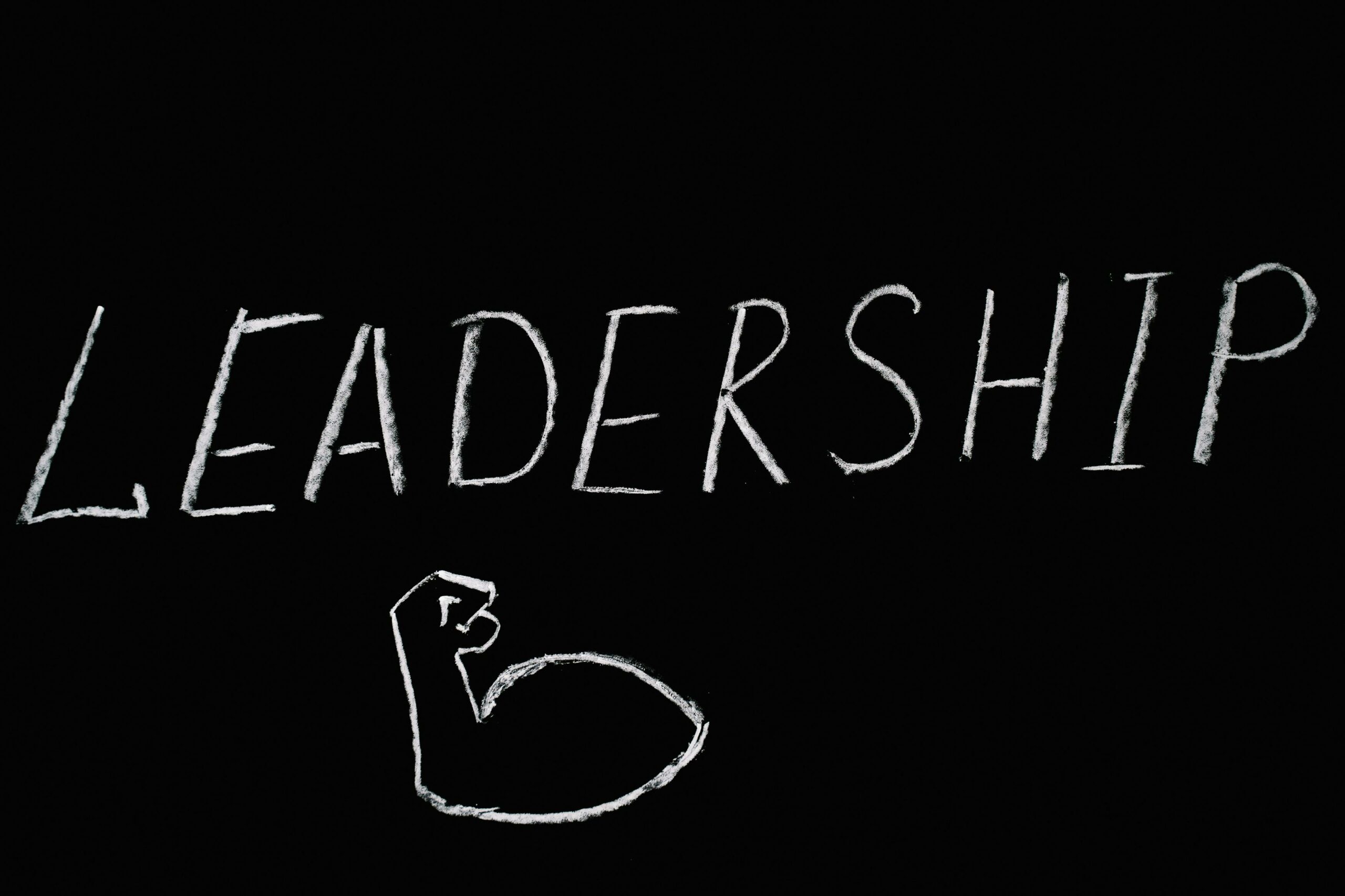 the words "leadership" written in chalk